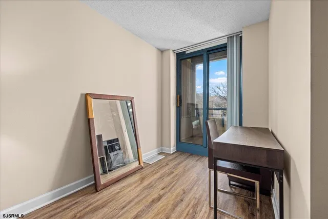 a view of a livingroom with furniture and wooden floor