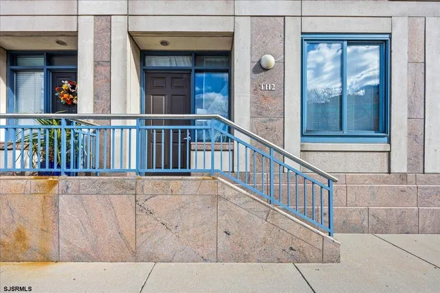 a view of a balcony with a potted plant