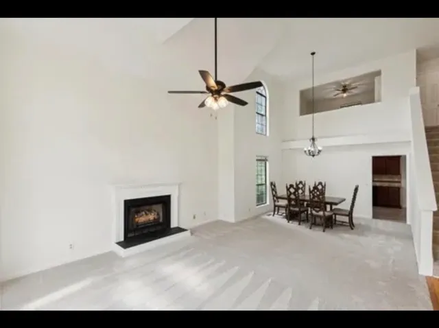 a view of a livingroom with furniture and a fireplace