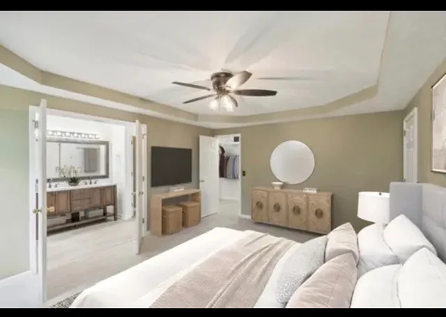 a bed room with furniture and a flat screen tv