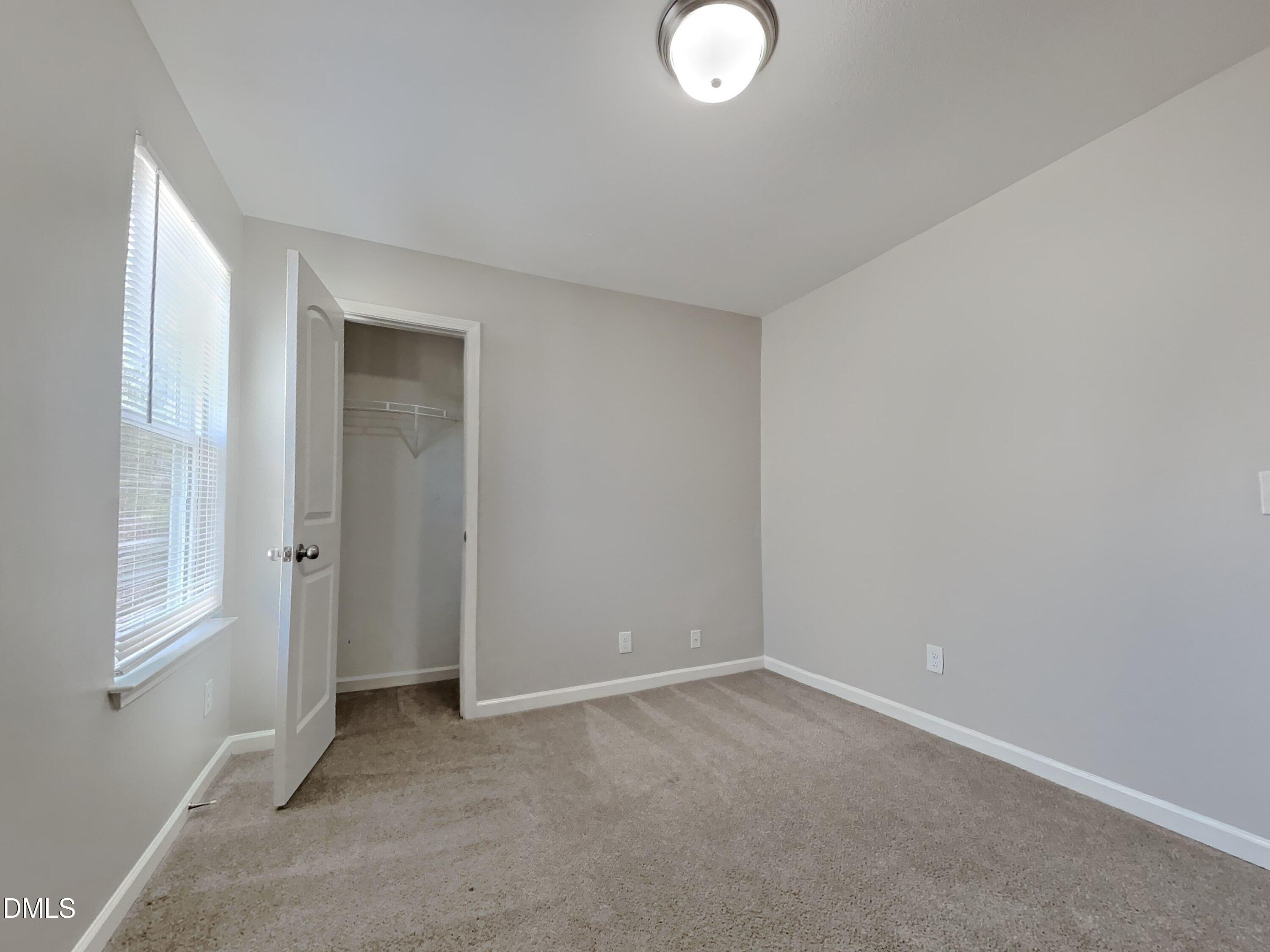 1925 Buffalo Way Durham, NC 27704 - Photo 12 of 16 an empty room with windows