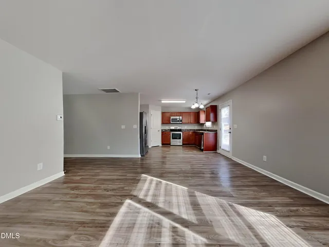 a view of a living room and kitchen