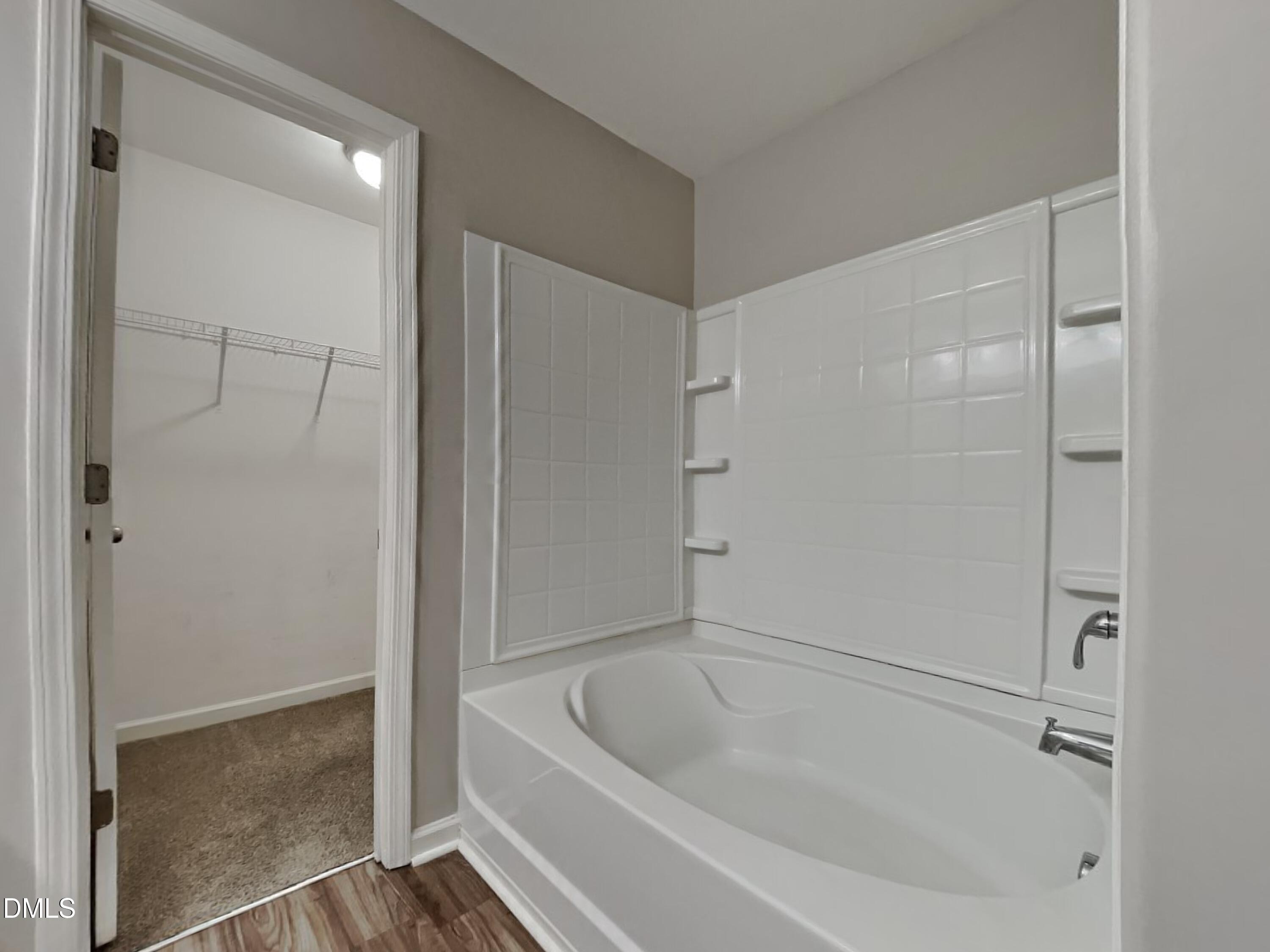 1925 Buffalo Way Durham, NC 27704 - Photo 8 of 16 a white bath tub sitting next to a shower