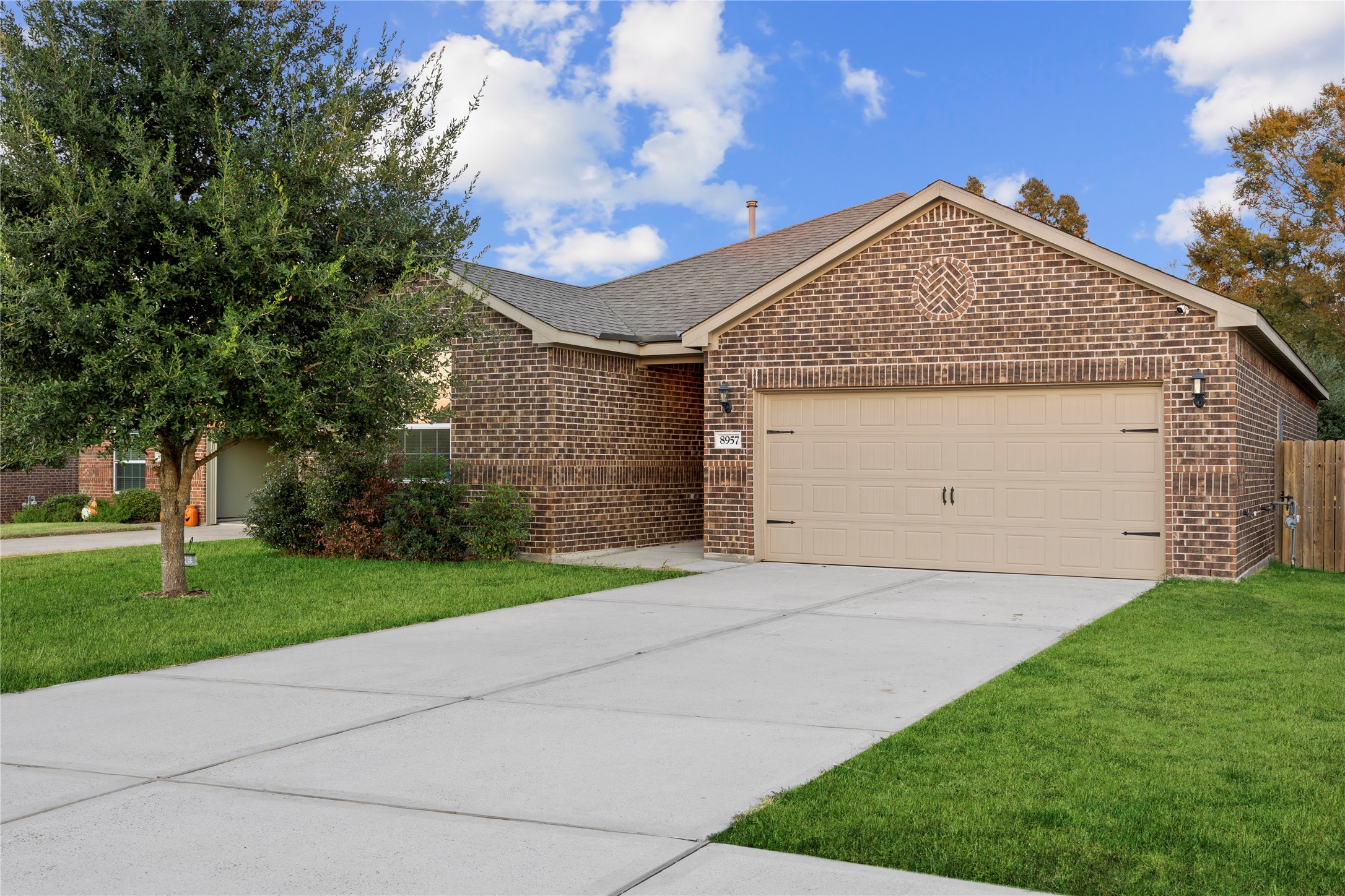 8957 Oval Glass Street Conroe, TX 77304 - Photo 2 of 30 a view of a house with a yard