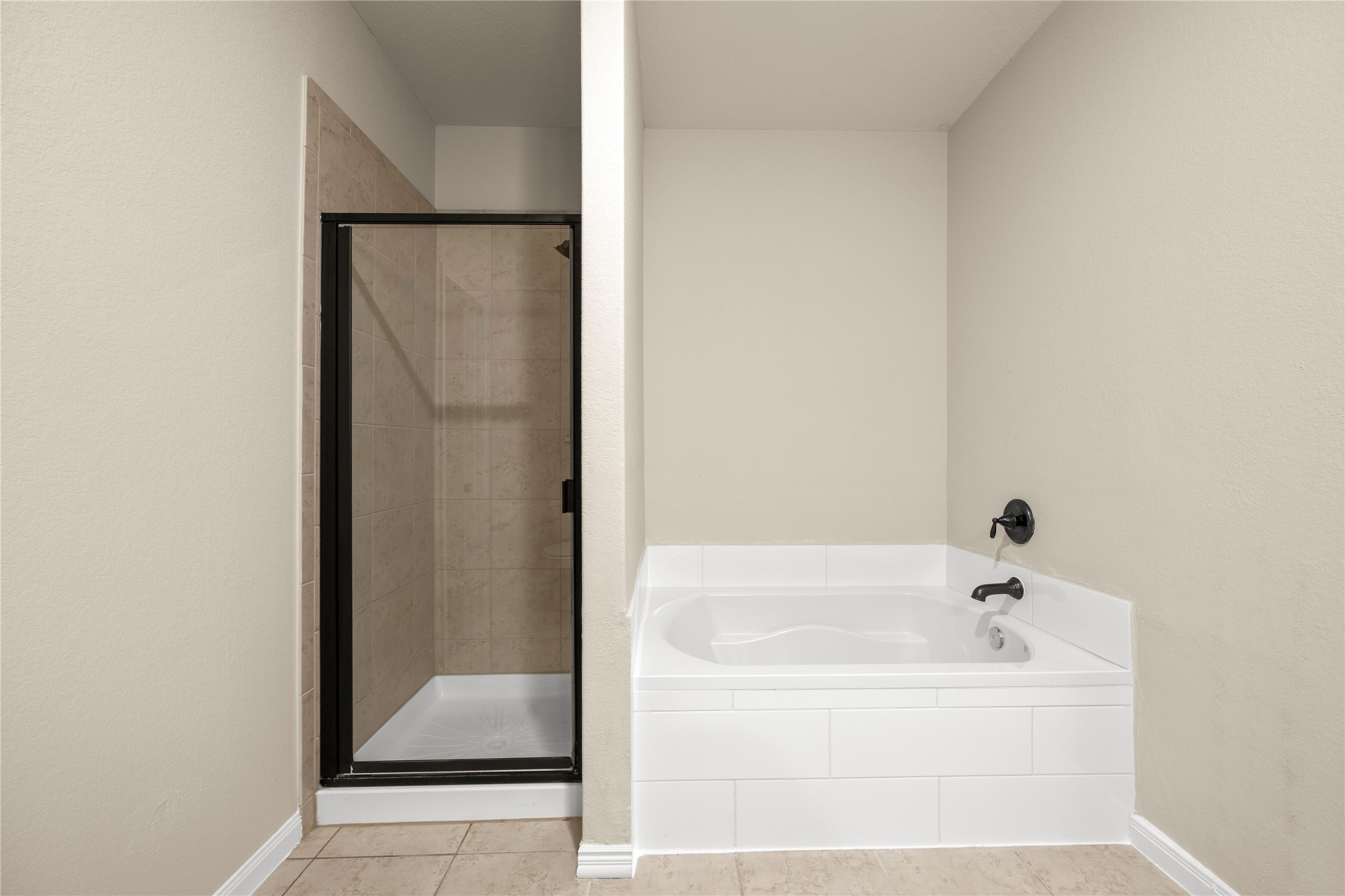 8957 Oval Glass Street Conroe, TX 77304 - Photo 24 of 30 a white bath tub sitting next to a white wall