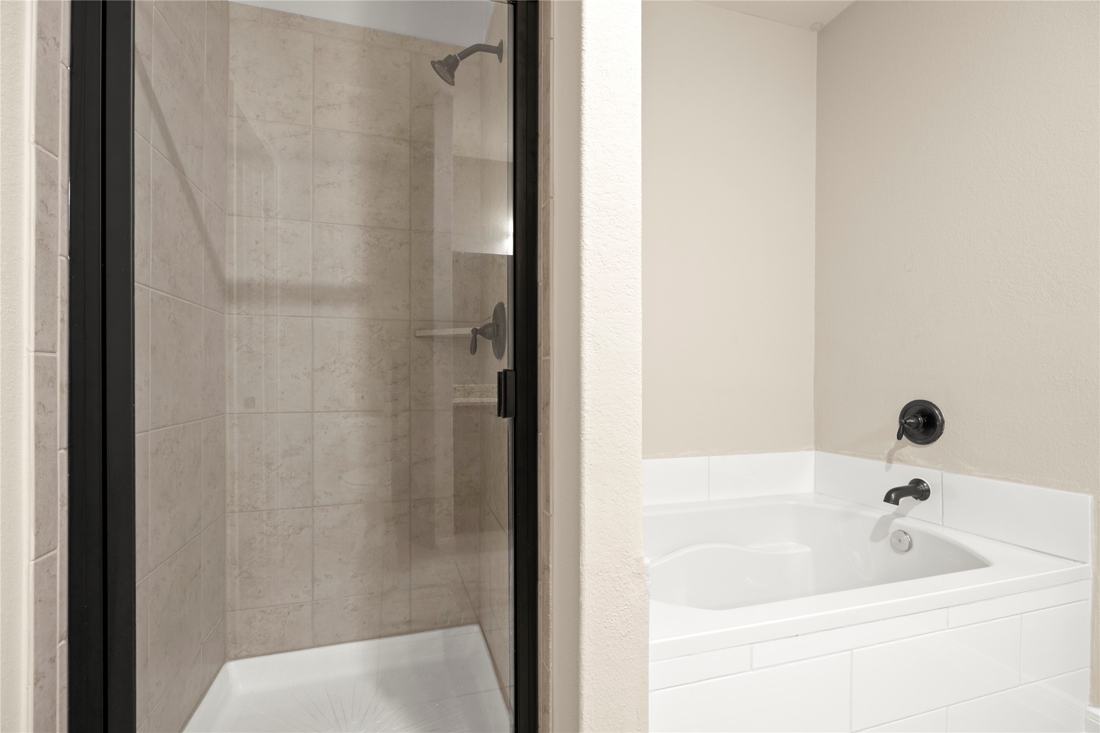 8957 Oval Glass Street Conroe, TX 77304 - Photo 25 of 30 a bathroom with a bathtub