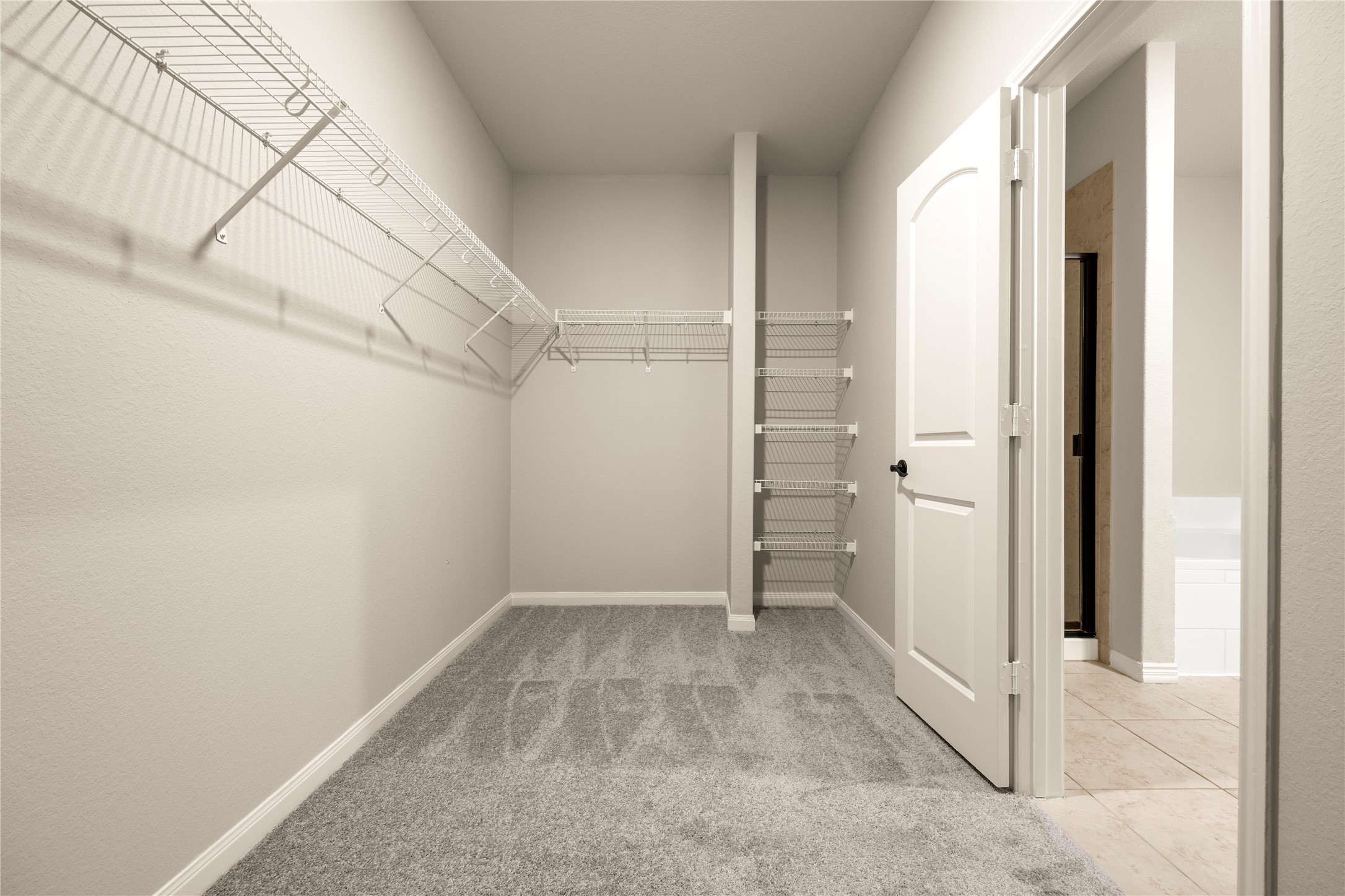 8957 Oval Glass Street Conroe, TX 77304 - Photo 27 of 30 a view of a room with white walls