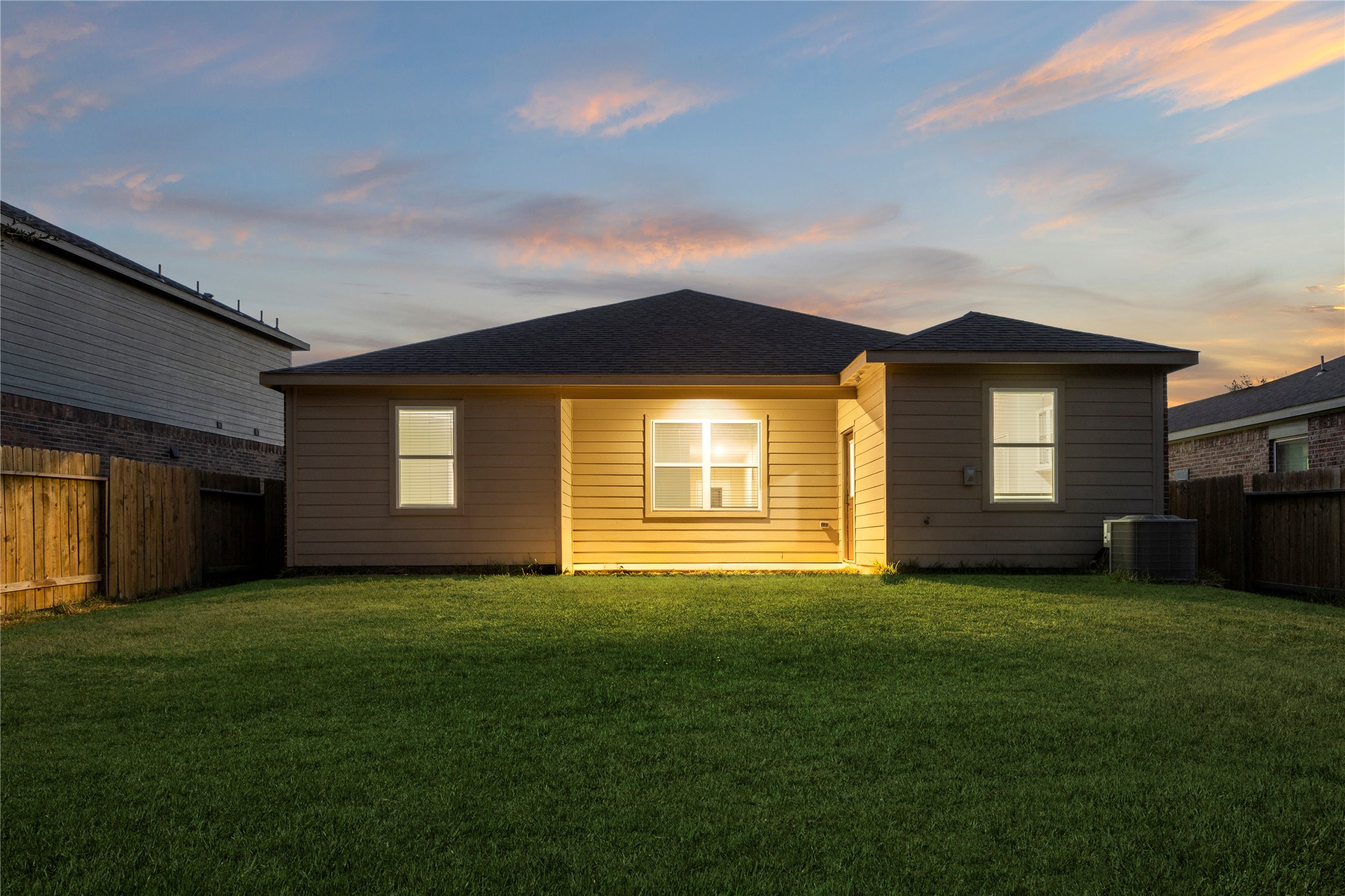 8957 Oval Glass Street Conroe, TX 77304 - Photo 28 of 30 a front view of a house with a yard