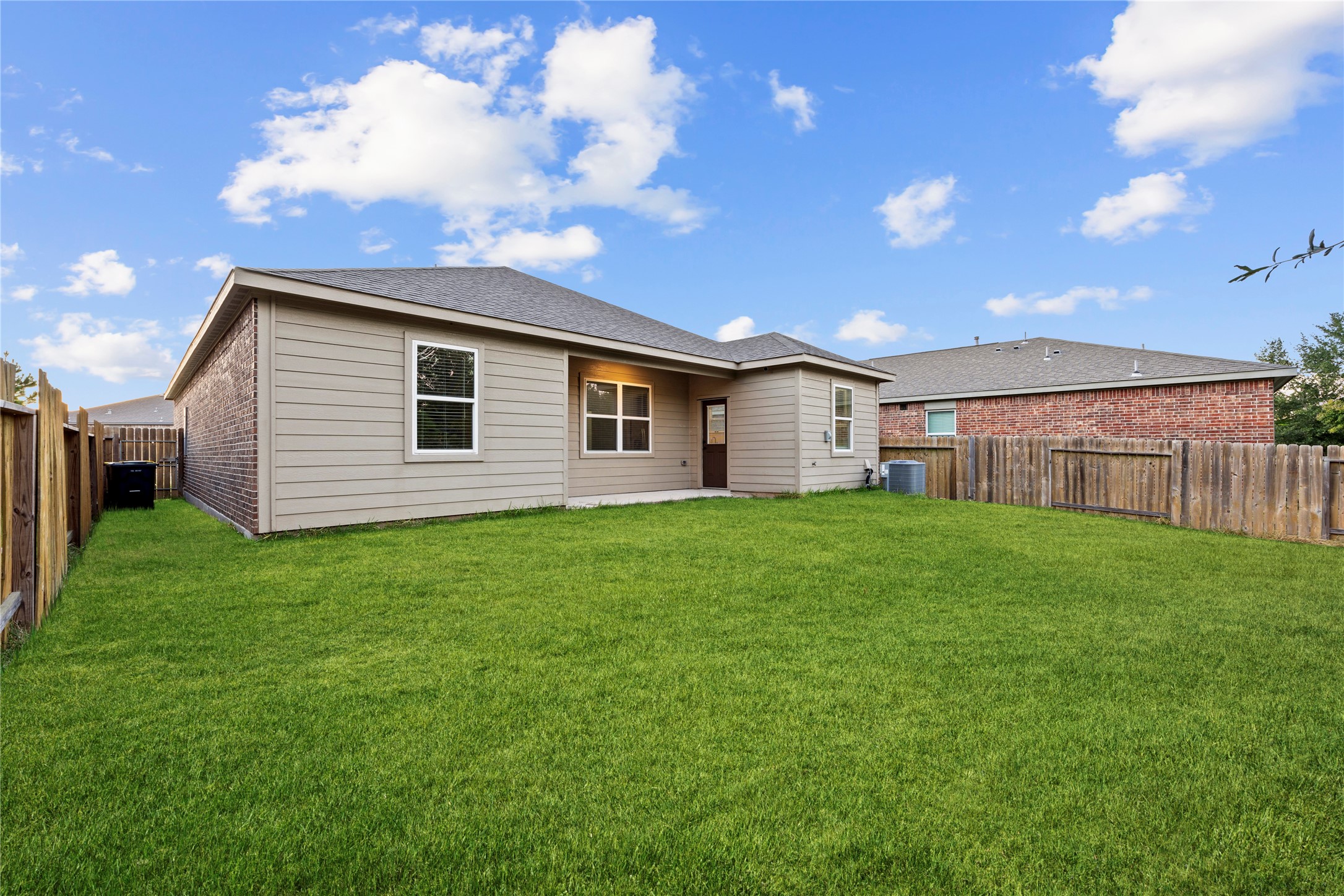 8957 Oval Glass Street Conroe, TX 77304 - Photo 30 of 30 a view of a backyard with a garden