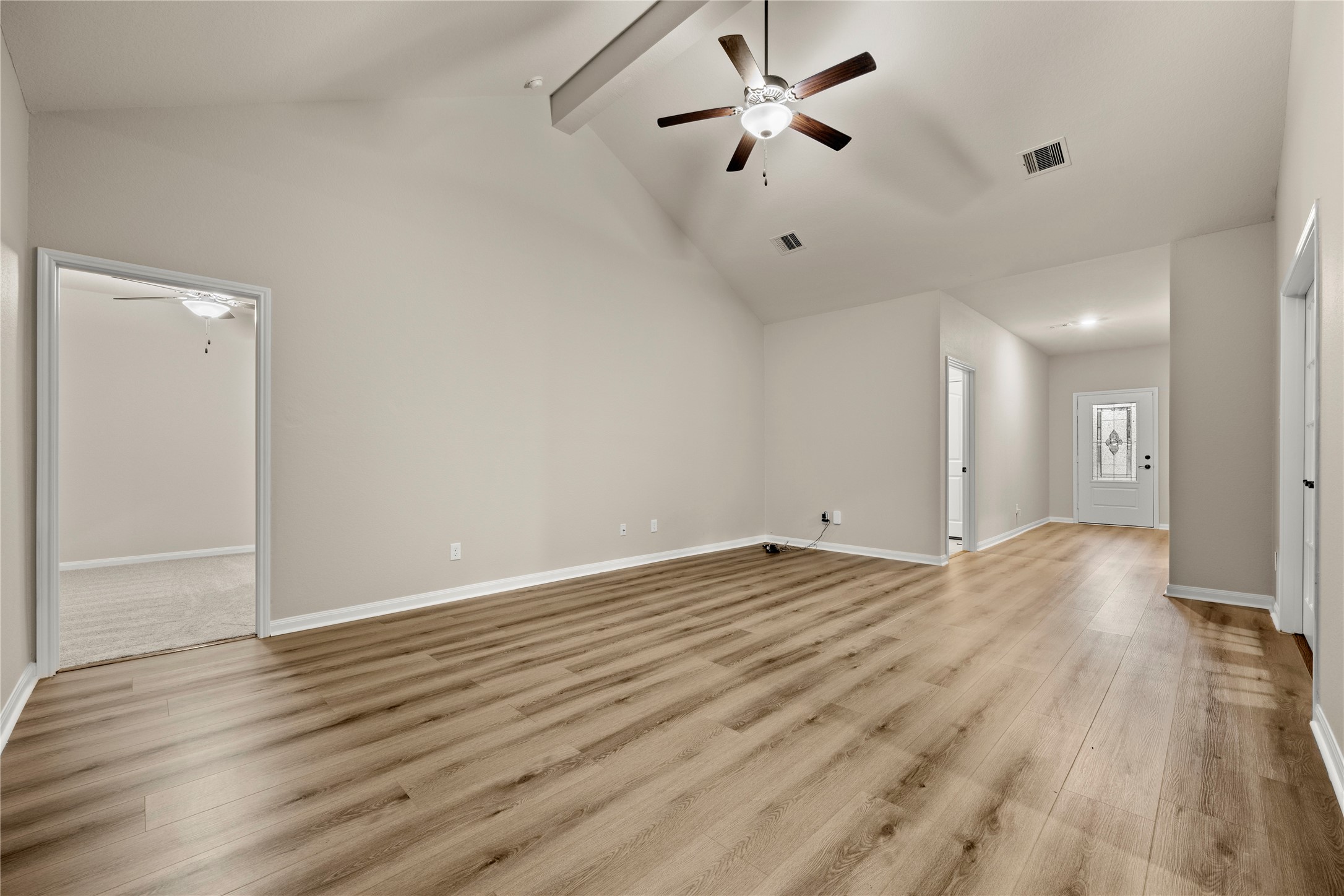 8957 Oval Glass Street Conroe, TX 77304 - Photo 6 of 30 wooden floor in an empty room with a window