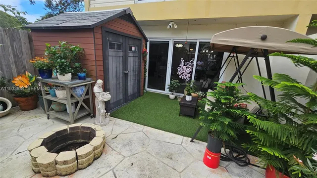 a kitchen with stainless steel appliances granite countertop a refrigerator sink and microwave