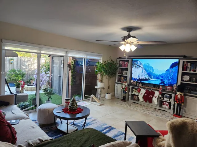 an aerial view of a house with a yard and lake view