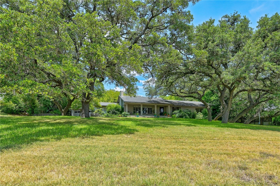 a view of a house with a big yard