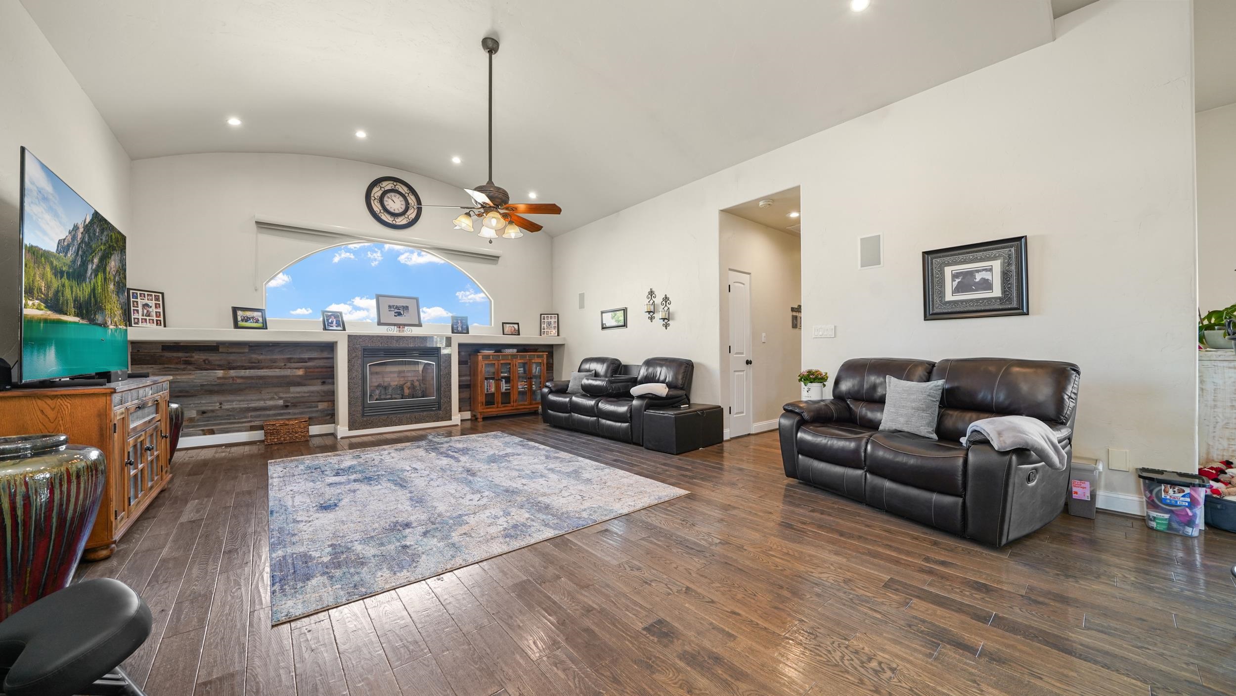 809 Mease Road Grand Junction, CO 81505 - Photo 12 of 38 a living room with furniture kitchen view and a fireplace