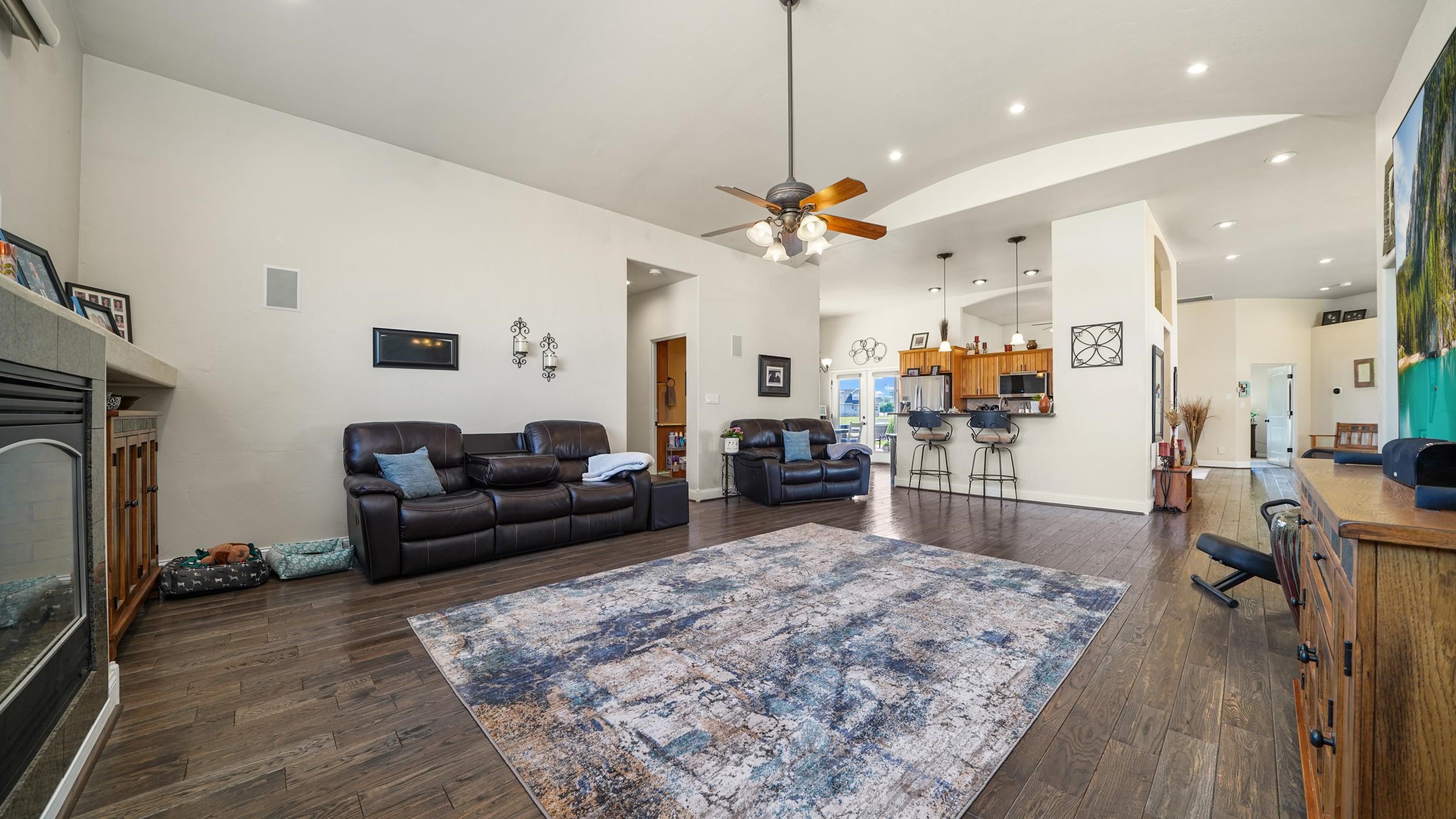809 Mease Road Grand Junction, CO 81505 - Photo 14 of 38 a living room with furniture kitchen view and a fireplace