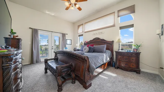 a bedroom with a bed and a chandelier