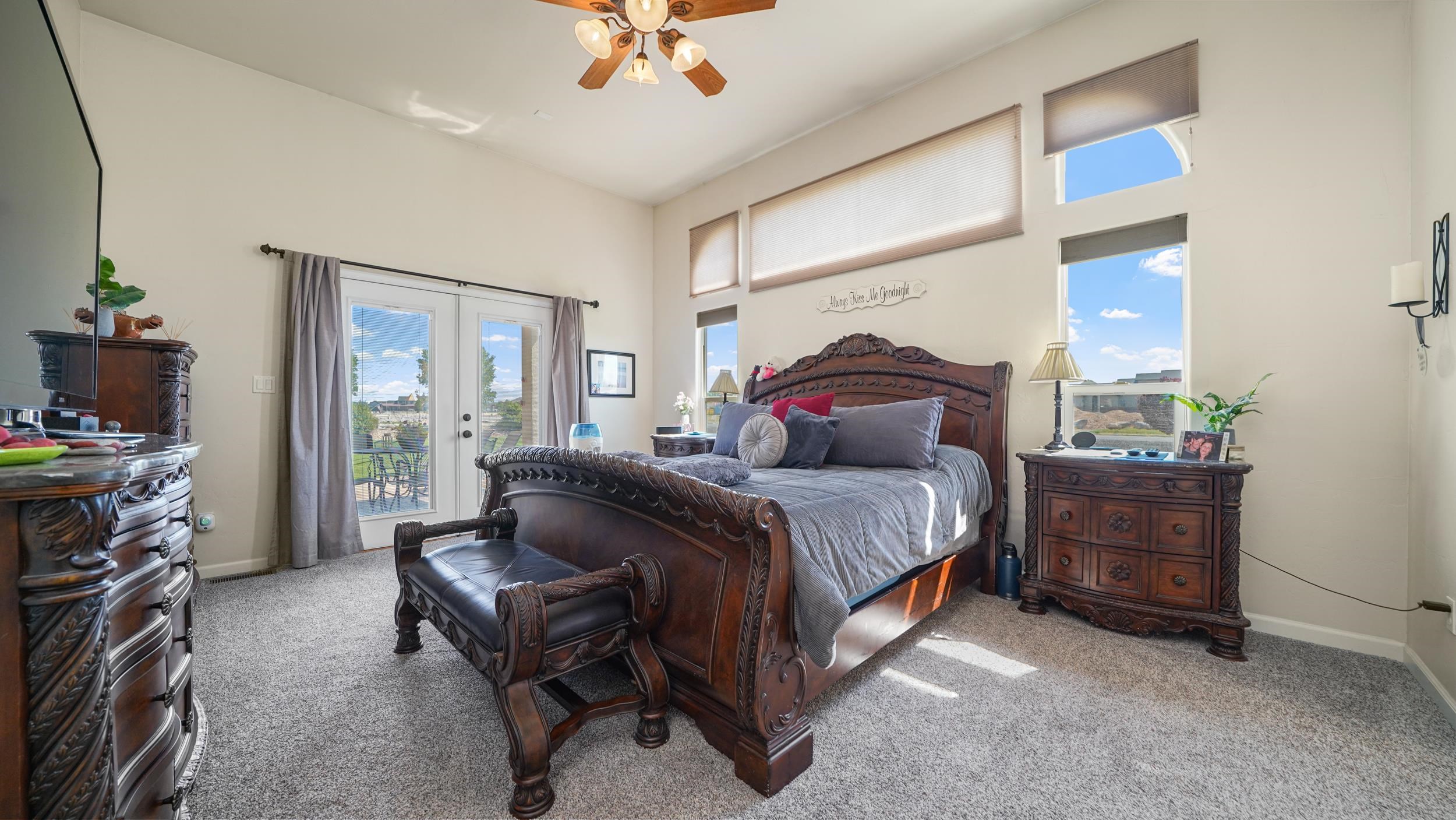 809 Mease Road Grand Junction, CO 81505 - Photo 15 of 38 a bedroom with a bed and a chandelier