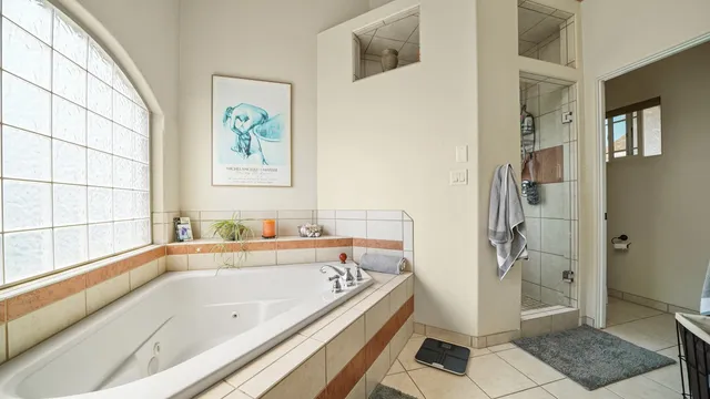 a bathroom with a bathtub and a shower