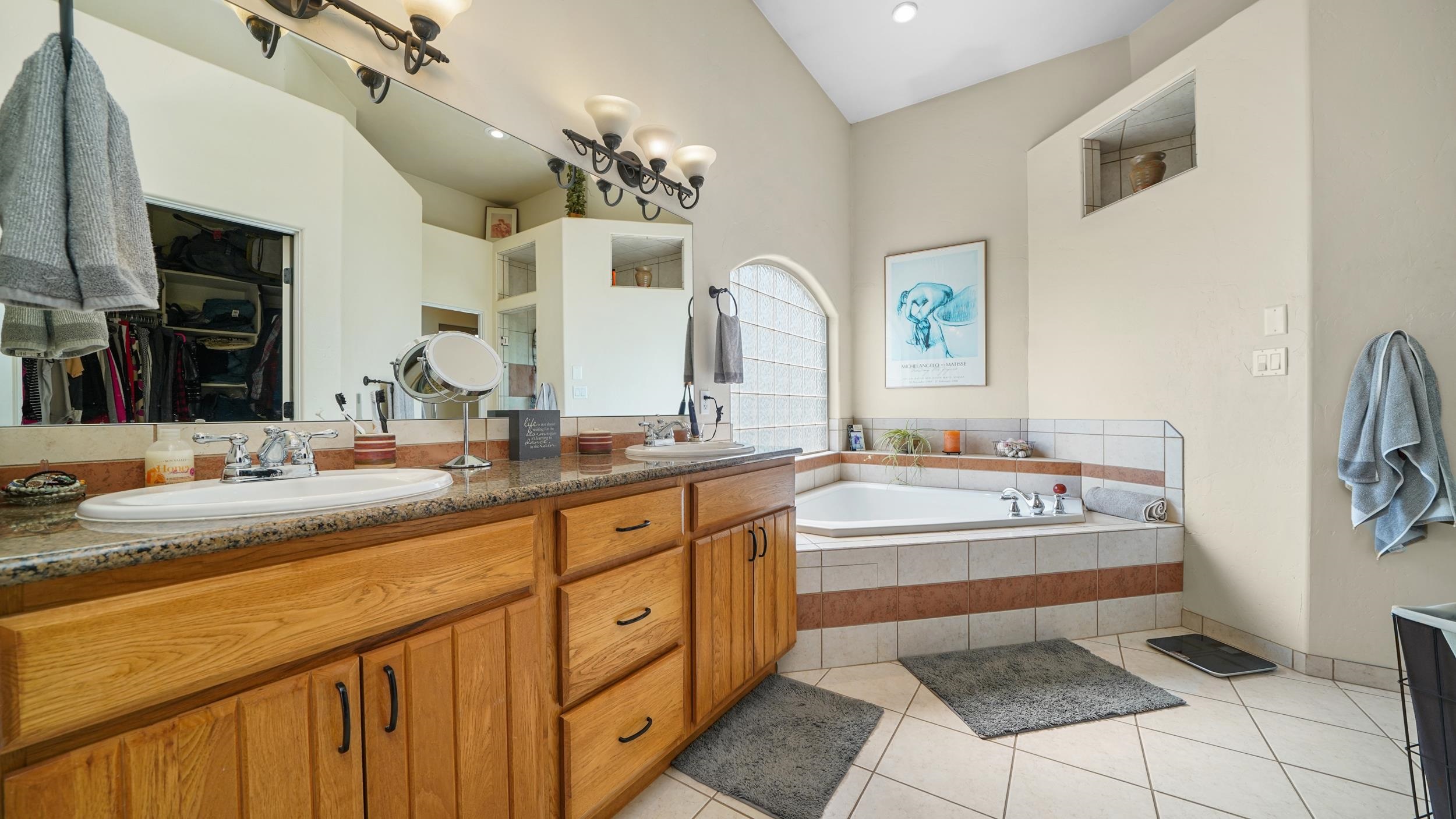 809 Mease Road Grand Junction, CO 81505 - Photo 18 of 38 a spacious bathroom with a sink double vanity granite and a mirror