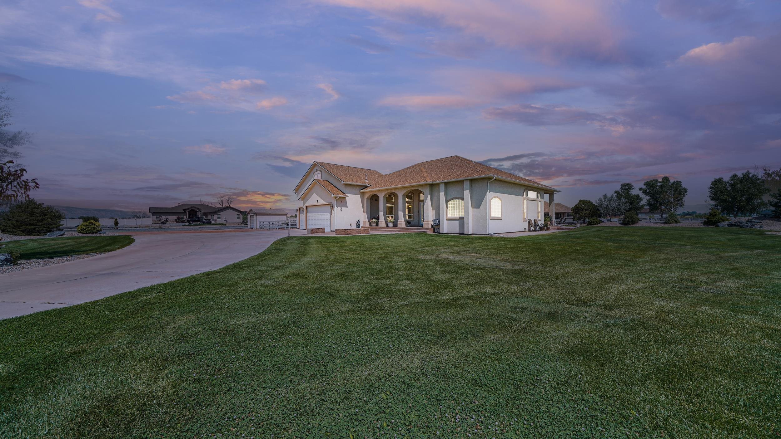 809 Mease Road Grand Junction, CO 81505 - Photo 2 of 38 a front view of house with yard and green space
