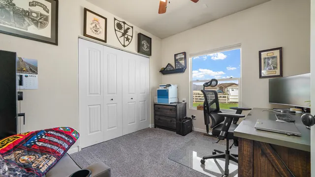 a bedroom with a workspace