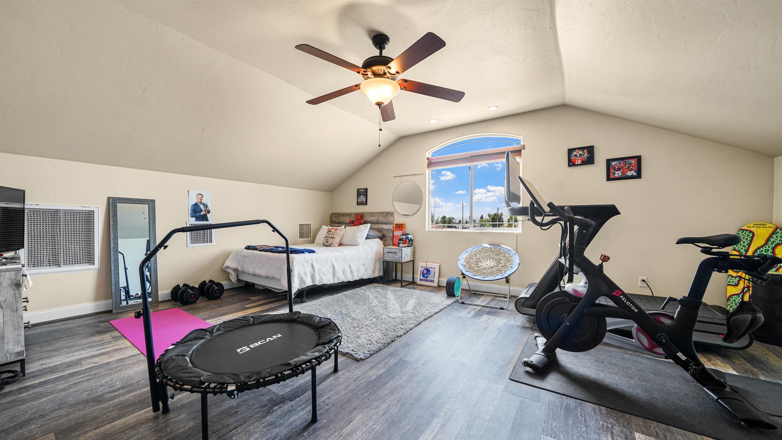 809 Mease Road Grand Junction, CO 81505 - Photo 24 of 38 a room with gym equipment and a wooden floor