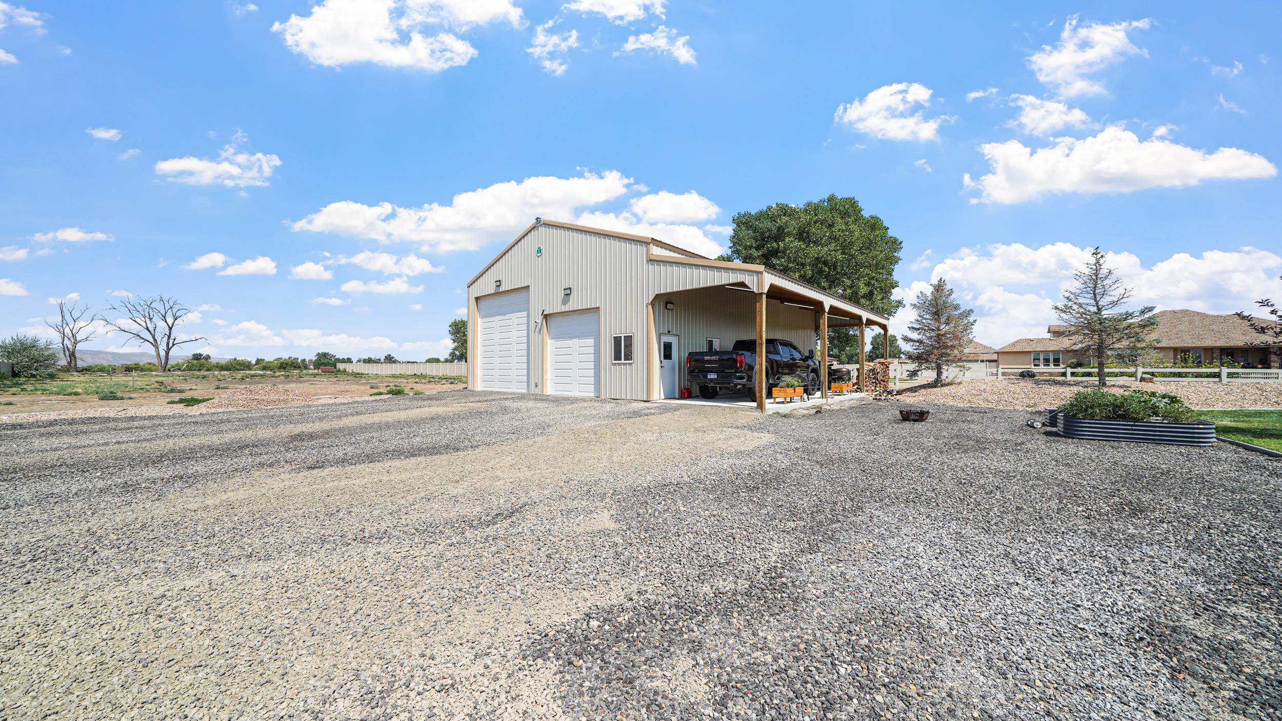 809 Mease Road Grand Junction, CO 81505 - Photo 31 of 38 a view of a house with a patio