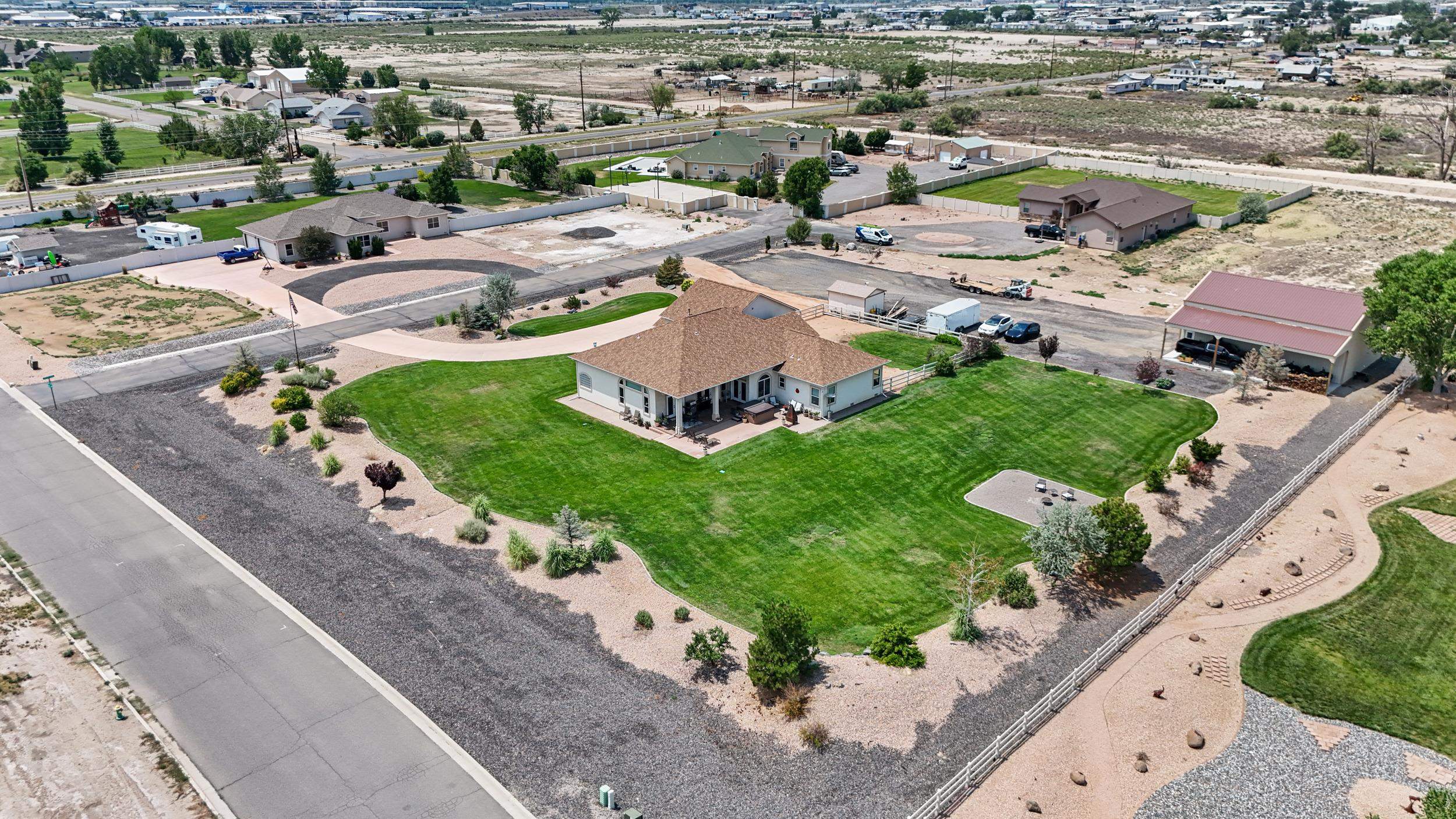 809 Mease Road Grand Junction, CO 81505 - Photo 38 of 38 an aerial view of multiple houses with yard