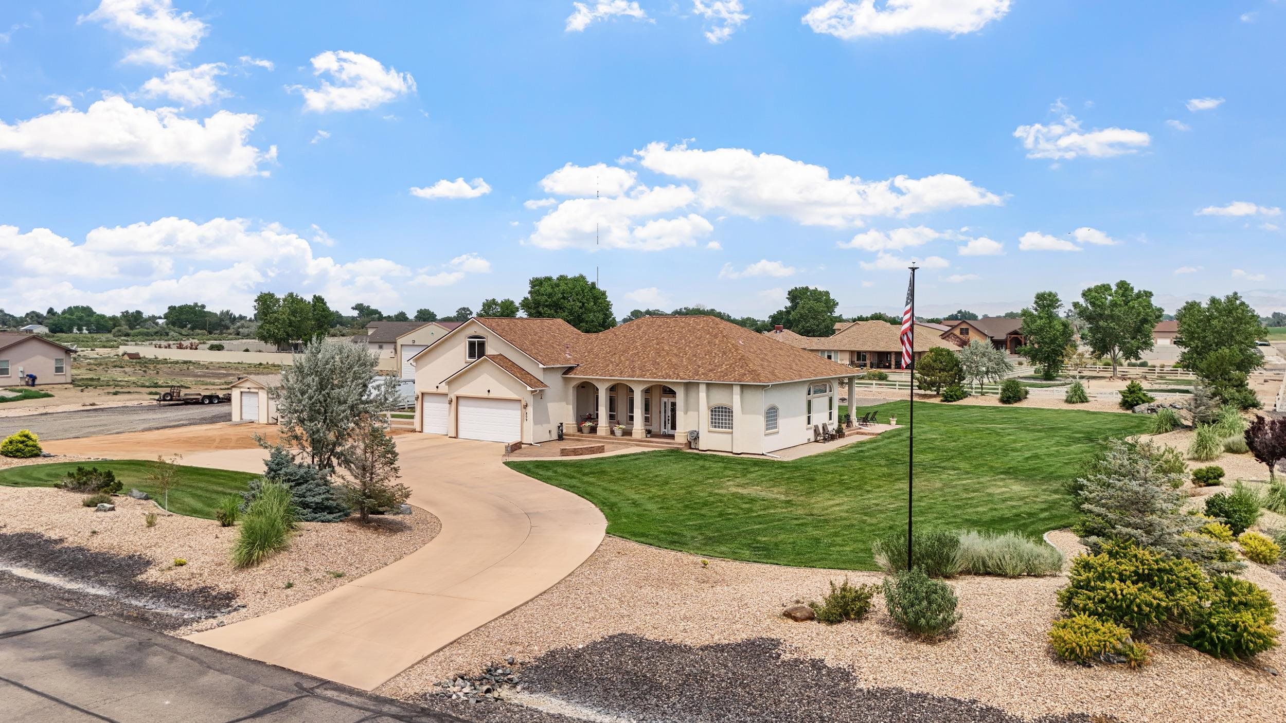 809 Mease Road Grand Junction, CO 81505 - Photo 4 of 38 a front view of a house with garden