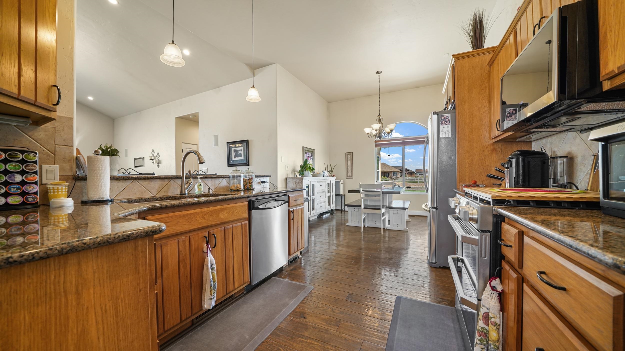809 Mease Road Grand Junction, CO 81505 - Photo 9 of 38 a kitchen with lots of counter space and painting on the wall