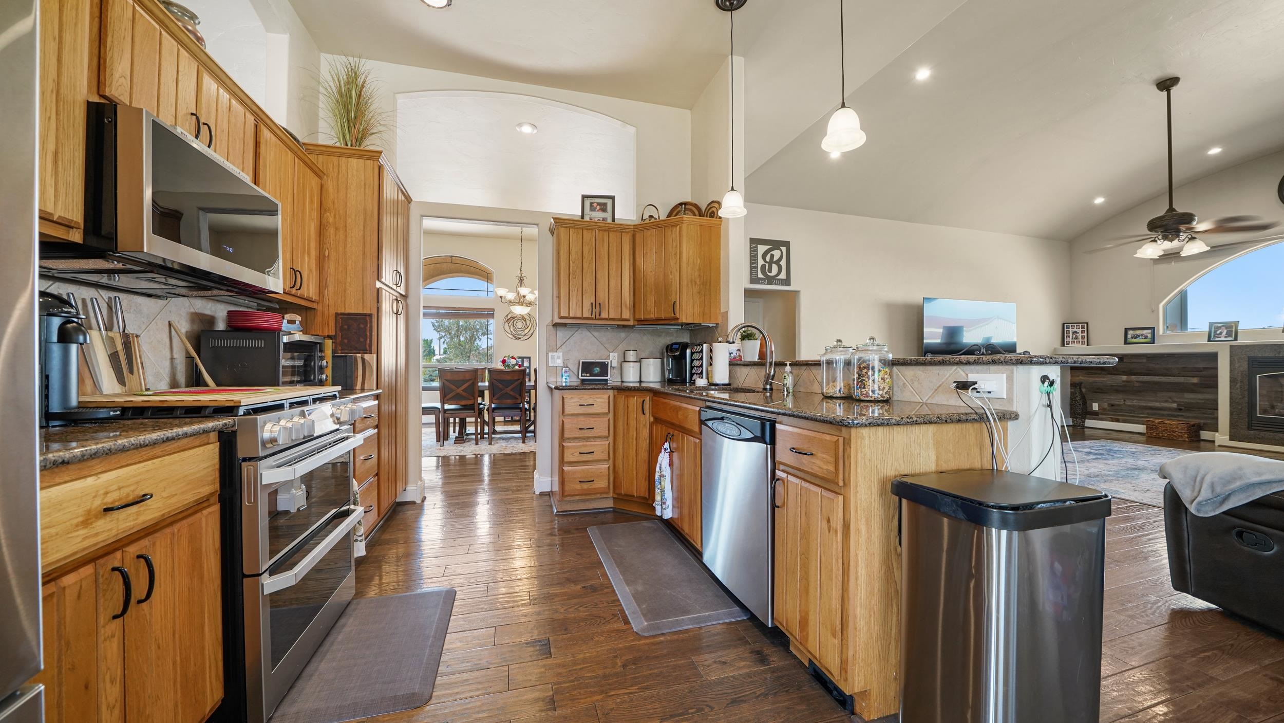 809 Mease Road Grand Junction, CO 81505 - Photo 10 of 38 a kitchen with stainless steel appliances granite countertop a refrigerator a stove top oven a sink and dishwasher