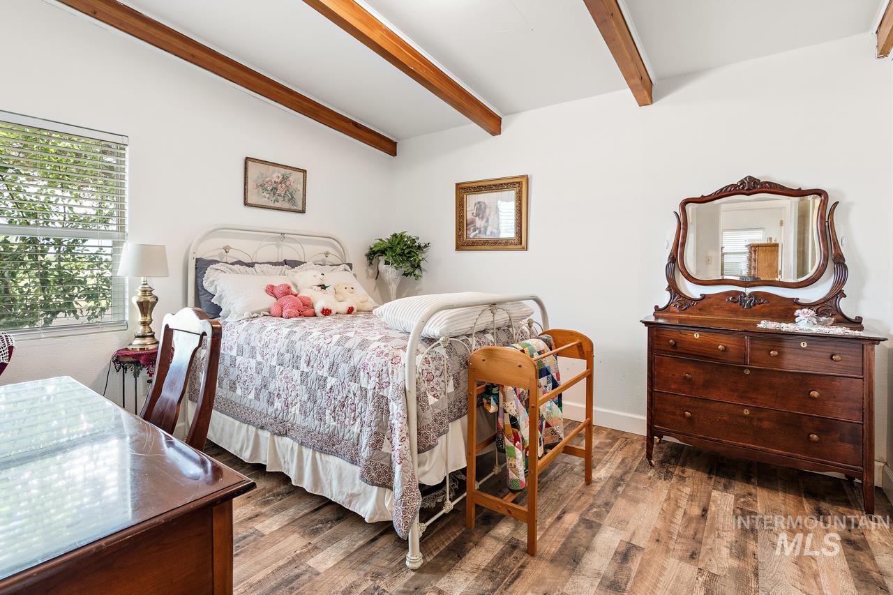 4417 Oak Road Ontario, OR 97914 - Photo 16 of 50 Bedroom featuring wood finished floors and beamed ceiling