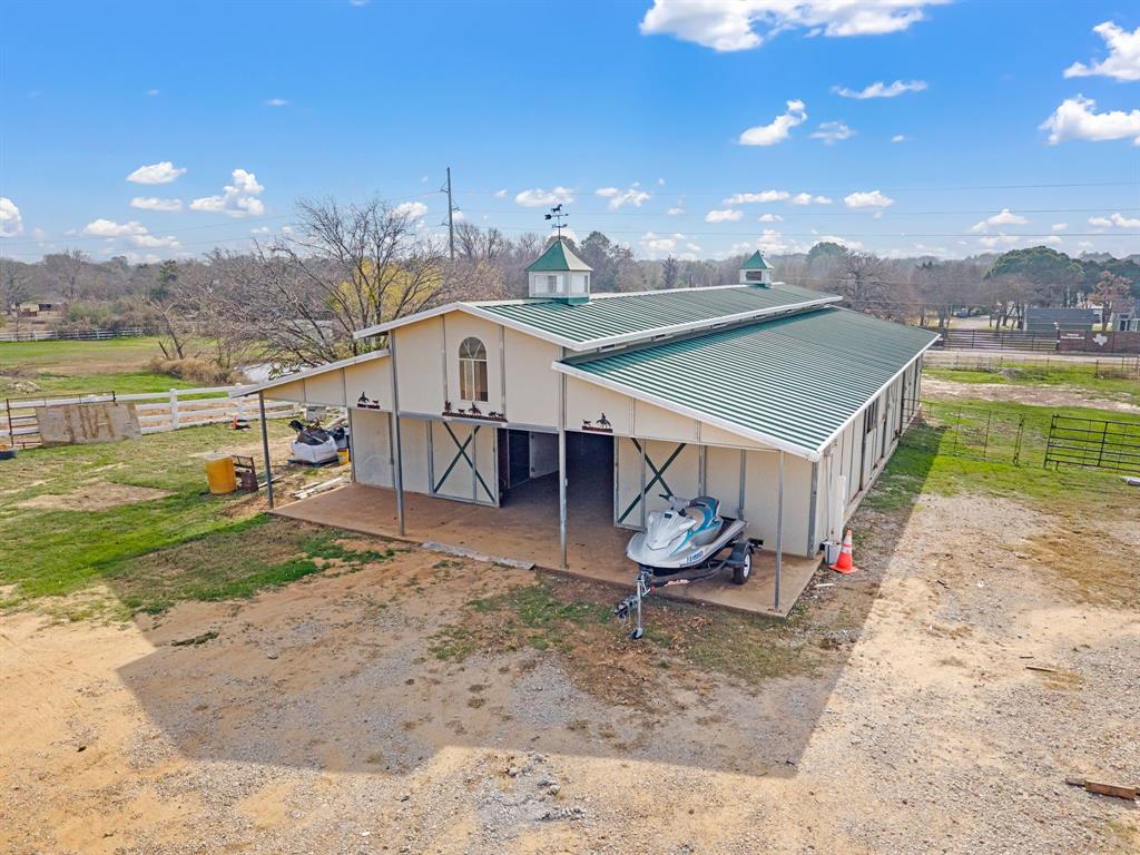 7260 Hudson Cemetery Road Mansfield, TX 76063 - Photo 4 of 40 Spacious barn structure featuring a green metal roof and white siding