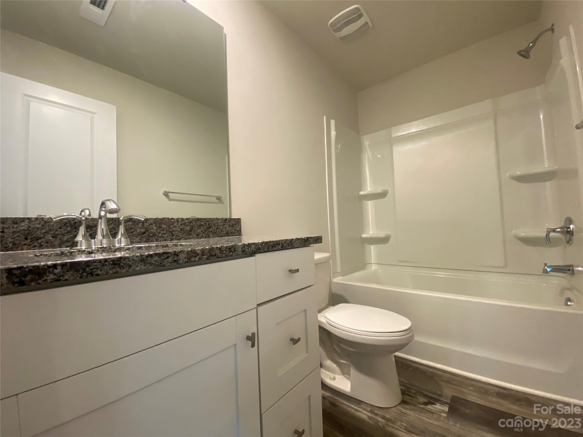 2903 Allen Road South Charlotte, NC 28269 - Photo 12 of 12 a bathroom with a granite countertop sink toilet and shower