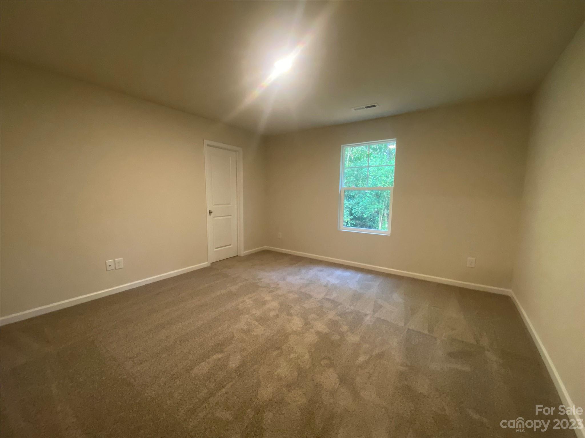 2903 Allen Road South Charlotte, NC 28269 - Photo 6 of 12 an empty room with a window