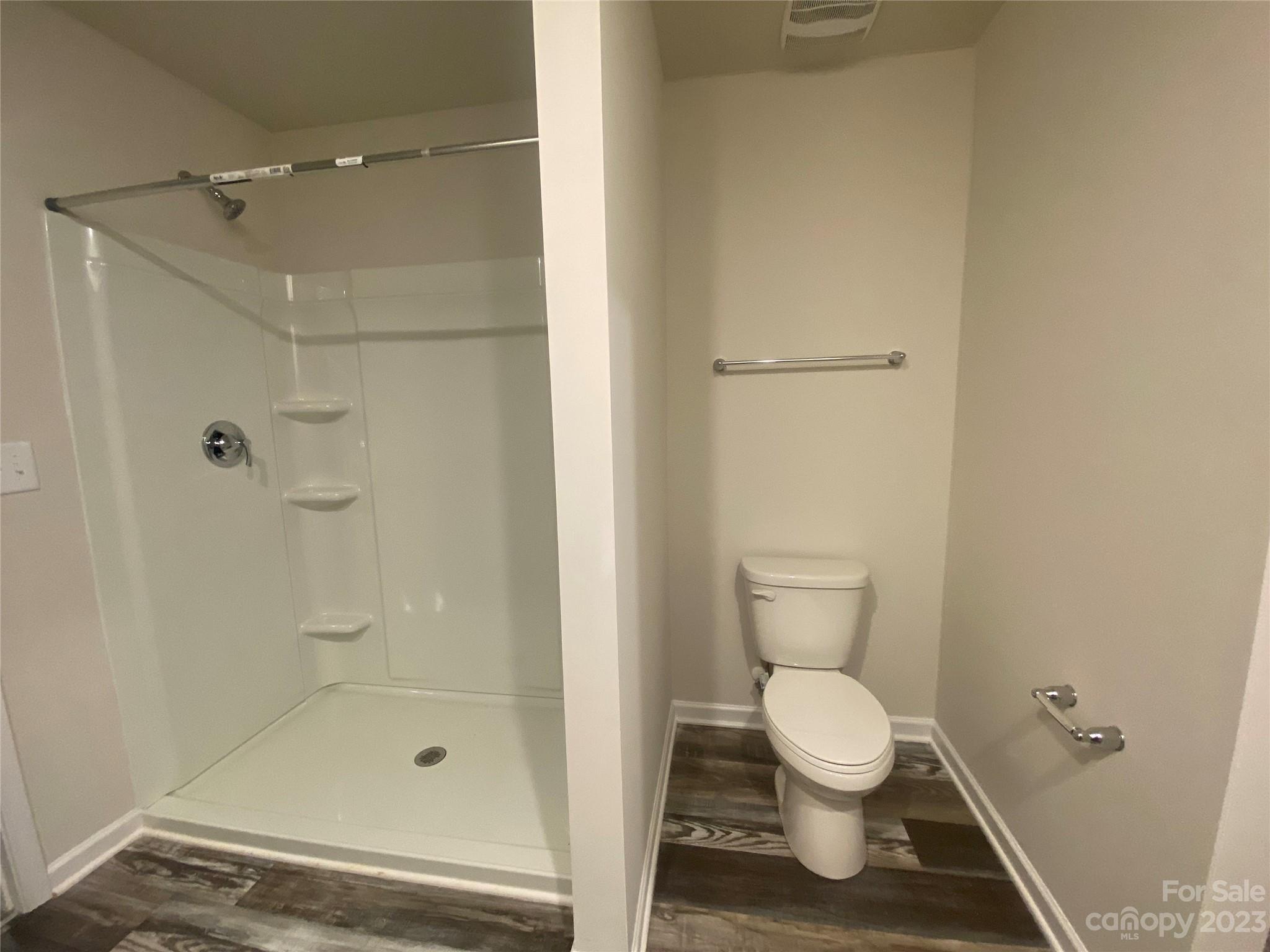 2903 Allen Road South Charlotte, NC 28269 - Photo 8 of 12 a bathroom with a toilet and a shower