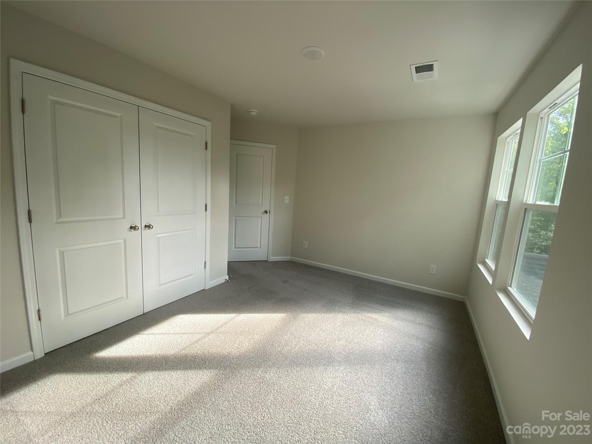 2903 Allen Road South Charlotte, NC 28269 - Photo 10 of 12 a view of an empty room with a window