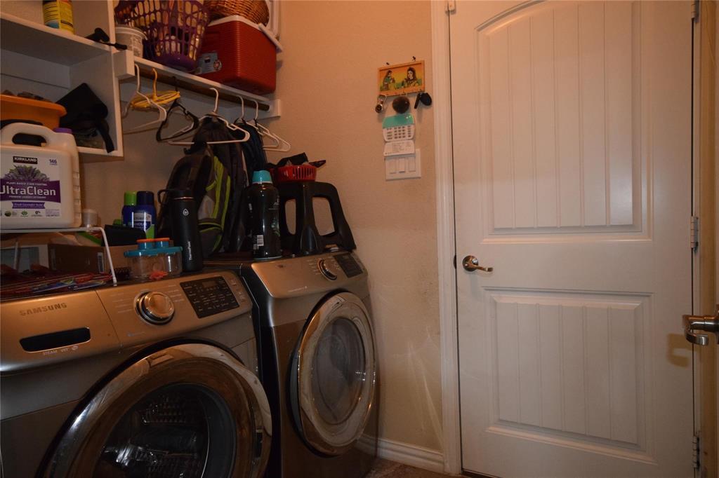 12421 Hitch Rack Way McKinney, TX 75071 - Photo 18 of 21 a view of walk in closet with clothes and shoes