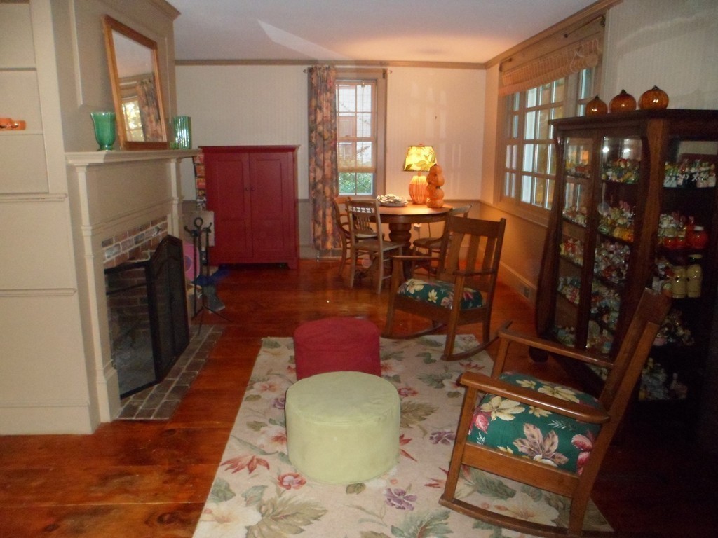 78 River Road Merrimac, MA 01860 - Photo 8 of 21 a living room with furniture a dining table and chairs with wooden floor