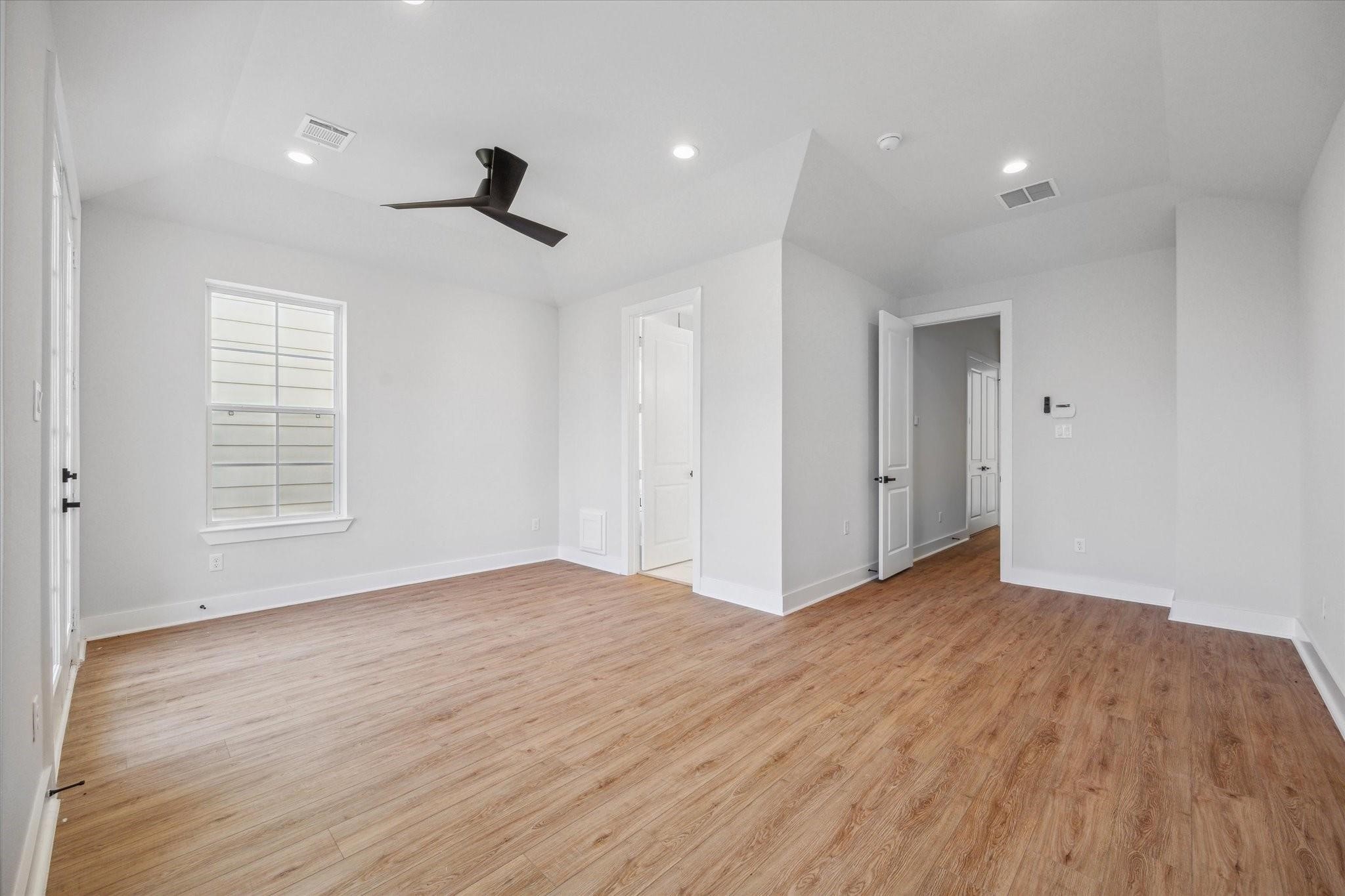 1035 West 17th Street Houston, TX 77008 - Photo 11 of 26 wooden floor in an empty room with a window