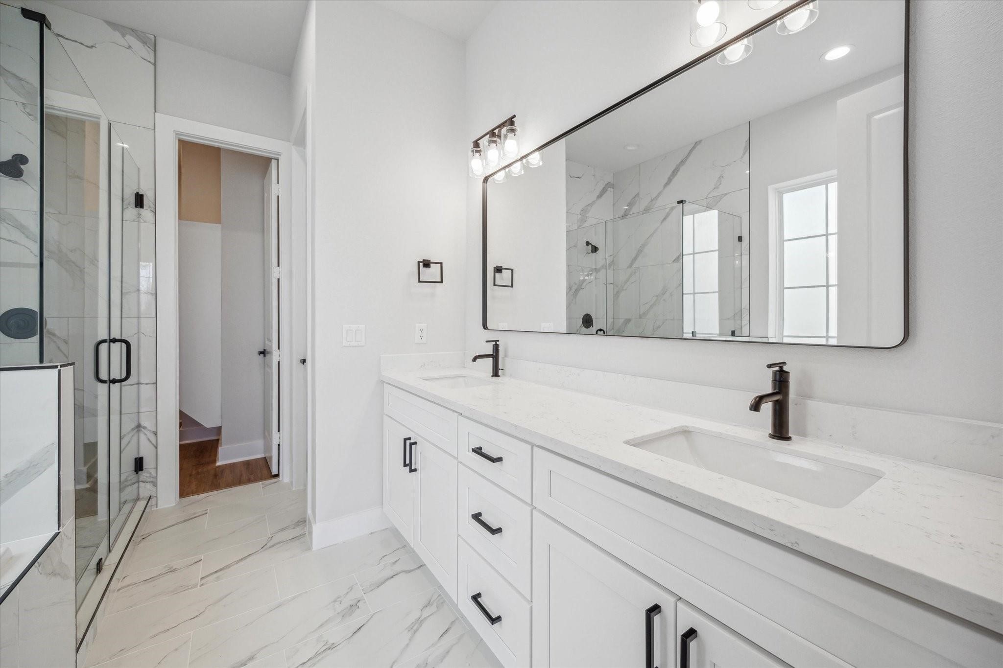 1035 West 17th Street Houston, TX 77008 - Photo 12 of 26 a bathroom with double vanity sink and mirror