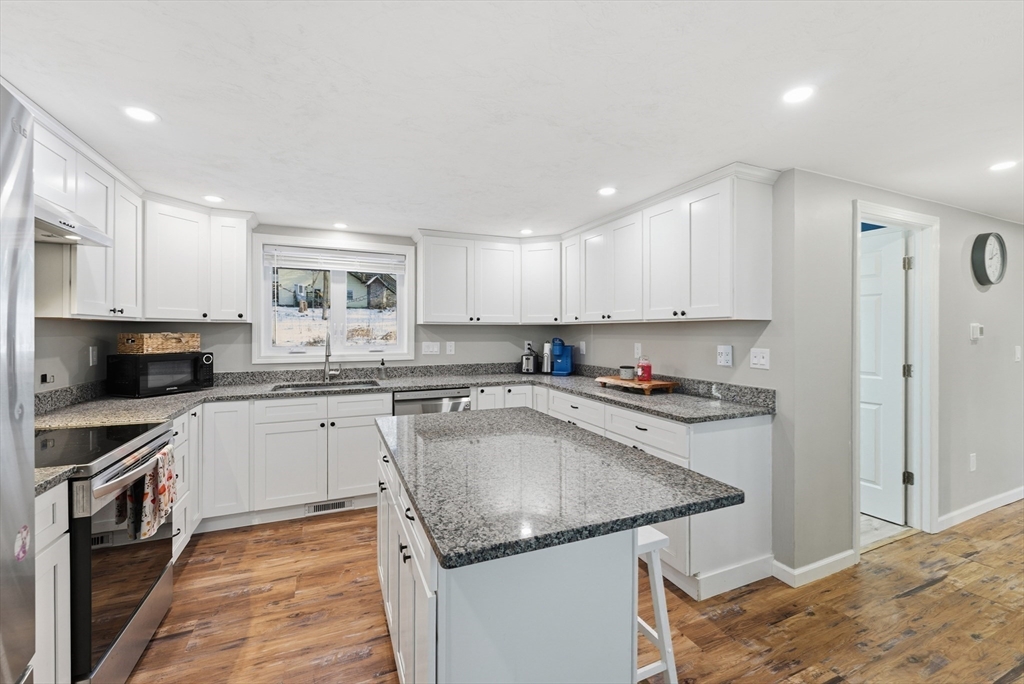 160 Cottage Street Athol, MA 01331 - Photo 5 of 35 a kitchen with stainless steel appliances granite countertop a sink stove and refrigerator