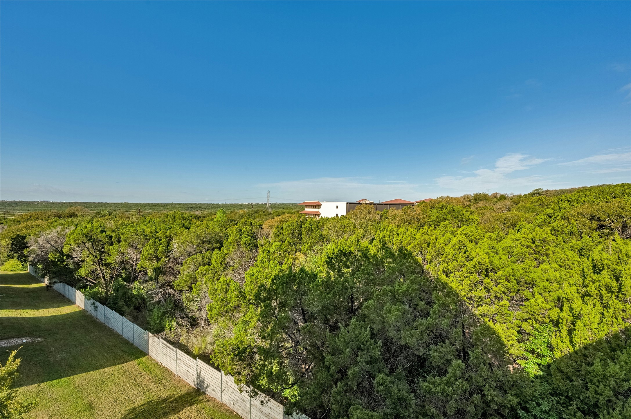2518 Sutherland Street Austin, TX 78746 - Photo 22 of 30 Vast green tree canopy offering serene natural surroundings.