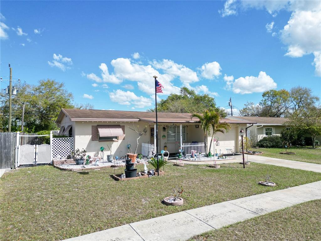 a view of a house with backyard porch and sitting area