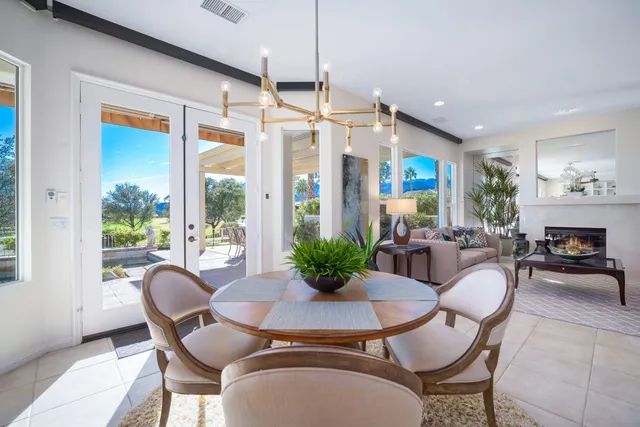 a view of a dining room with furniture window and outside view