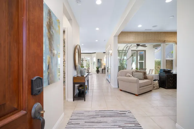 a living room with furniture and a rug