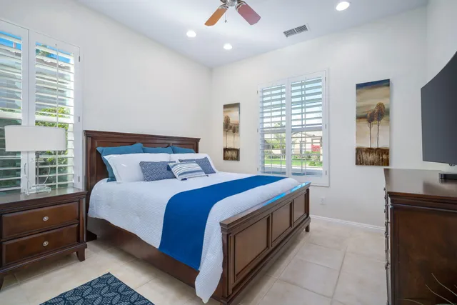 a bed room with a bed and a window