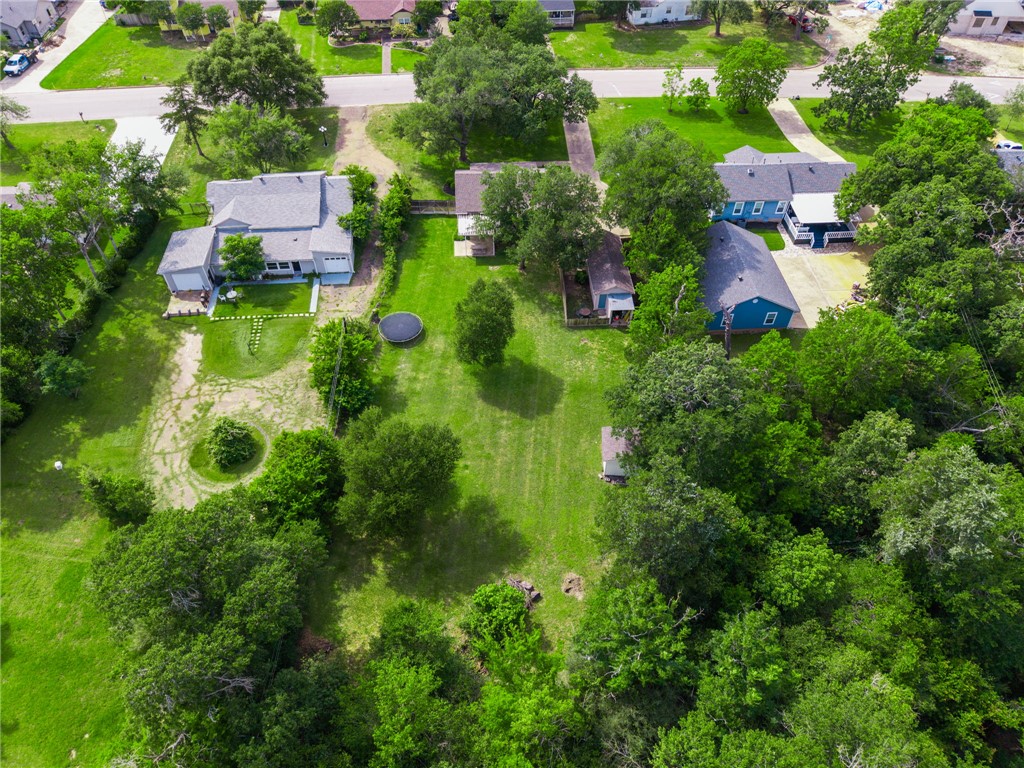 715 Inwood Drive Bryan, TX 77802 - Photo 34 of 34 an aerial view of residential house with outdoor space and trees all around