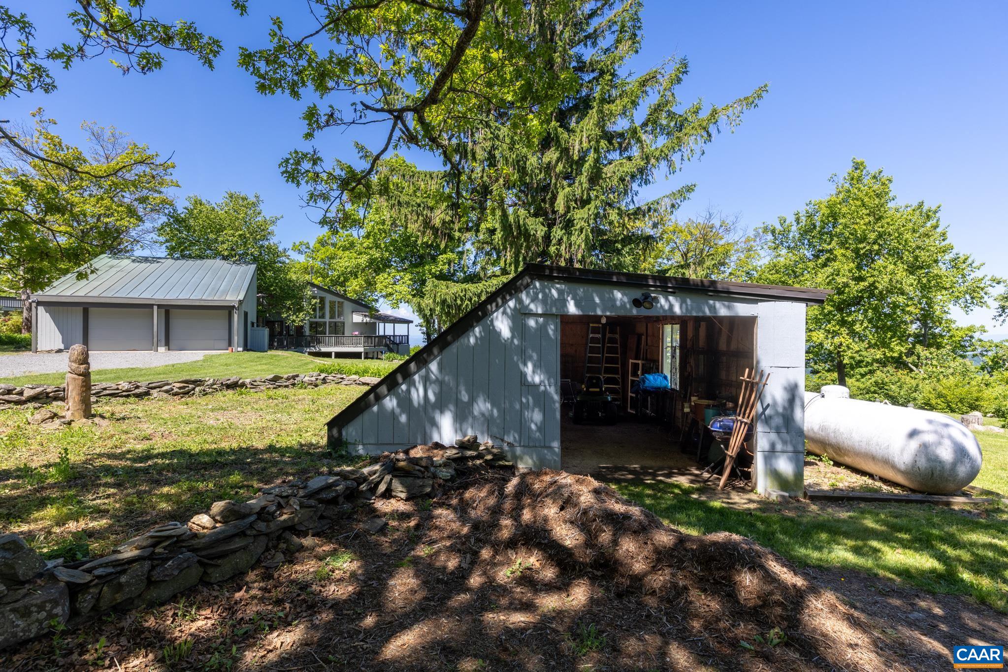 7098 Bucks Elbow Mountain Road Crozet, VA 22932 - Photo 43 of 57 a view of house with backyard space and garden