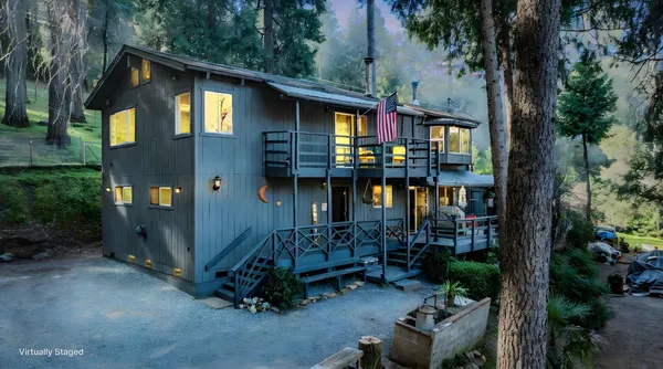 a front view of a house with yard and seating area